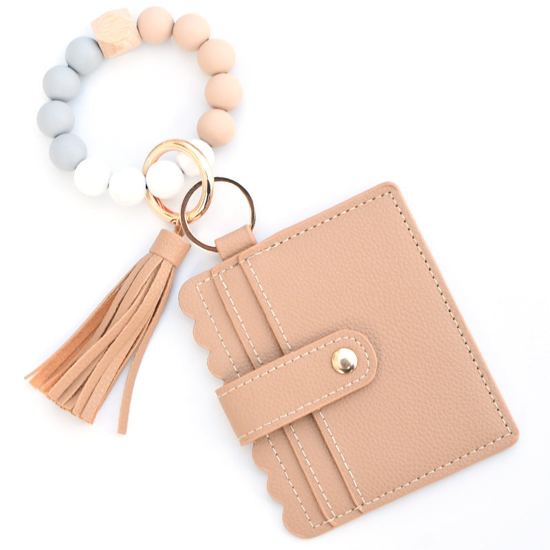 Llavero colorido al por mayor de la muñeca del monedero de la borla de la PU de los granos del silicón